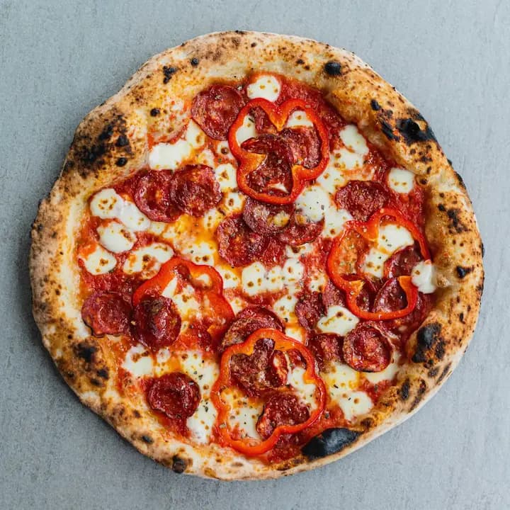 Neapolitan pizza with spicy salami (pepperoni)