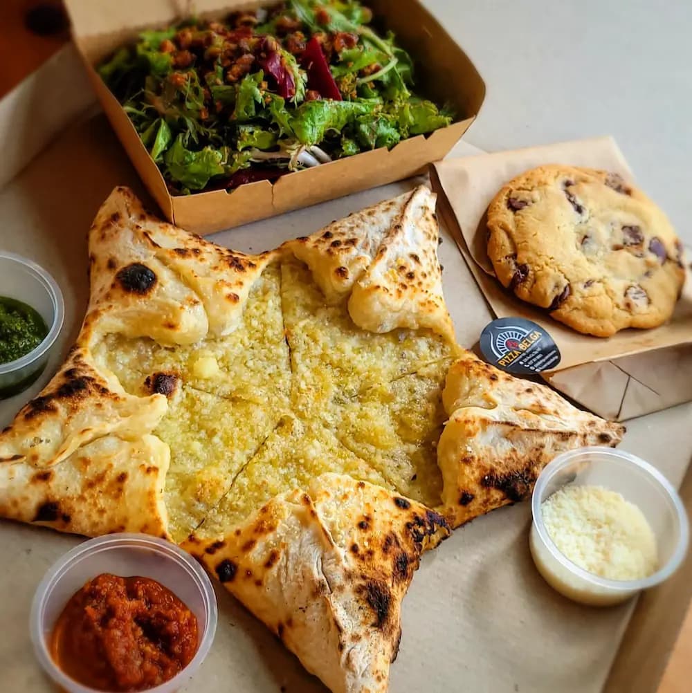 Star-shaped Garlic Bread served with various pesto sauces and parmesan